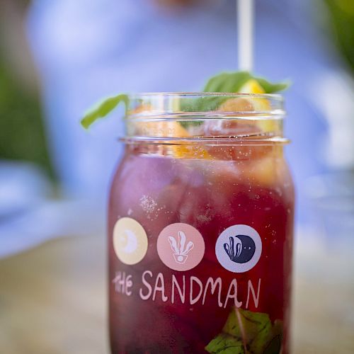 A mason jar with a drink labeled 