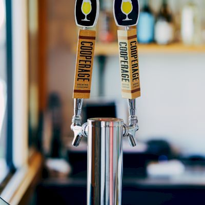 This image shows two beer tap handles labeled 