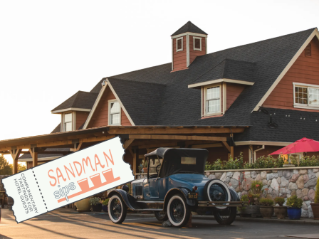 The image shows a vintage car parked in front of a rustic building with a ticket overlay reading 